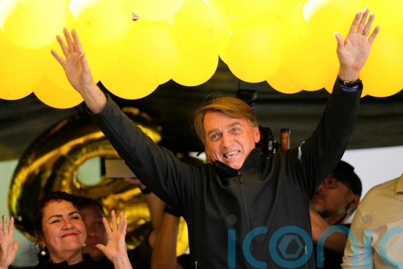 Brazil’s Bolsonaro grabs at heckler and tries to take phone