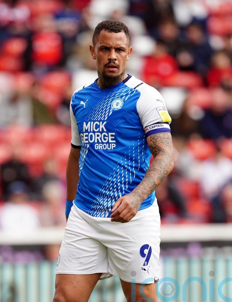 Jonson Clarke-Harris and Jack Marriott help in-form Peterborough thrash Lincoln