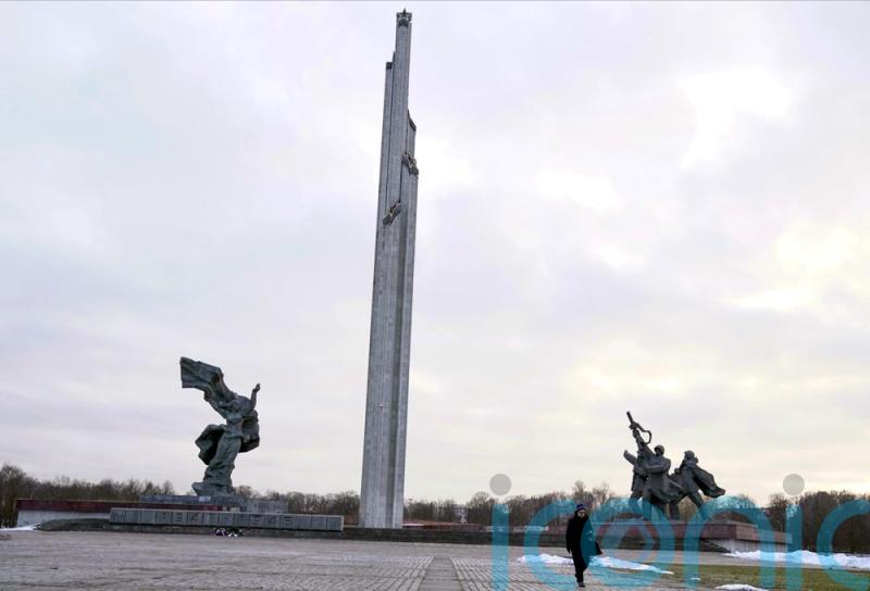 Soviet-era monument’s obelisk comes down in Latvia