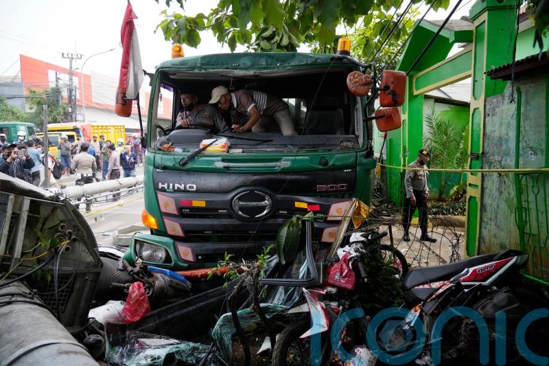 At least 10 die after truck crashes at school bus stop in Indonesia