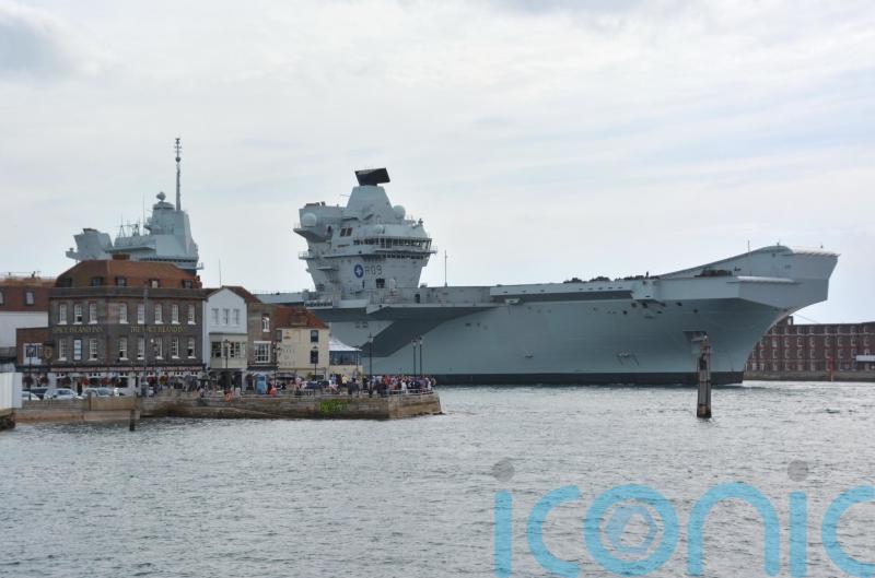 Broken down Royal Navy aircraft carrier returns to home base ahead of repairs