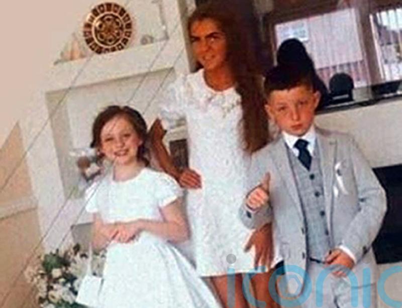 Flowers and candles at Tallaght home of siblings who died in violent incident