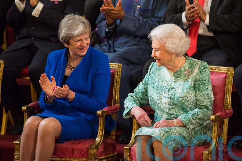 Theresa May shares cheesy tale about Queen in Commons tribute