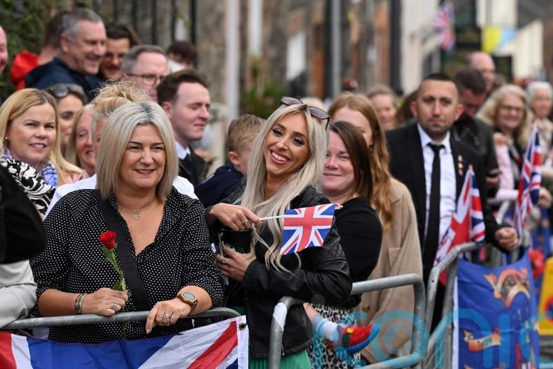 Thousands flock to village with royal connections to welcome King