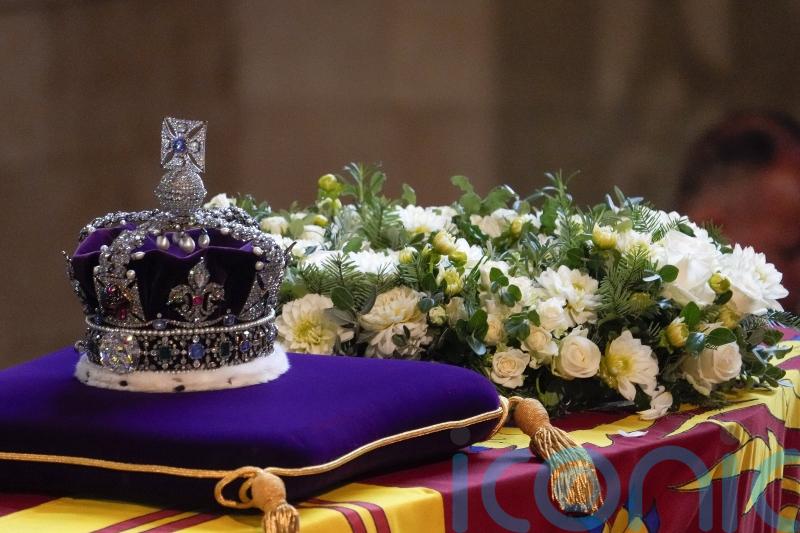 Imperial State Crown and Balmoral and Windsor flowers placed on Queen’s coffin