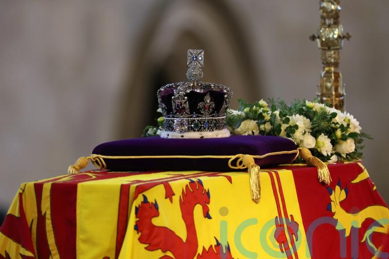 Lying in state: Visitors take a few moments to say goodbye to the Queen