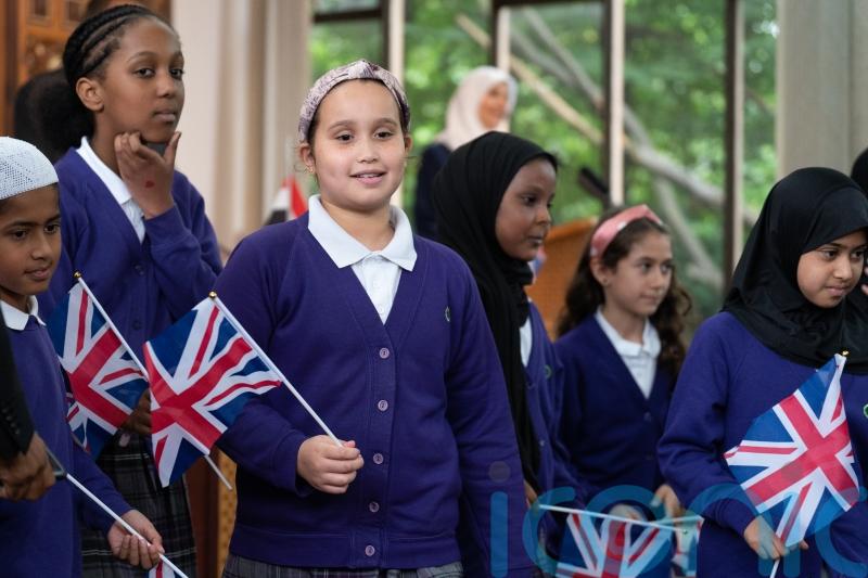 Muslim community leaders come together to sing God Save The King