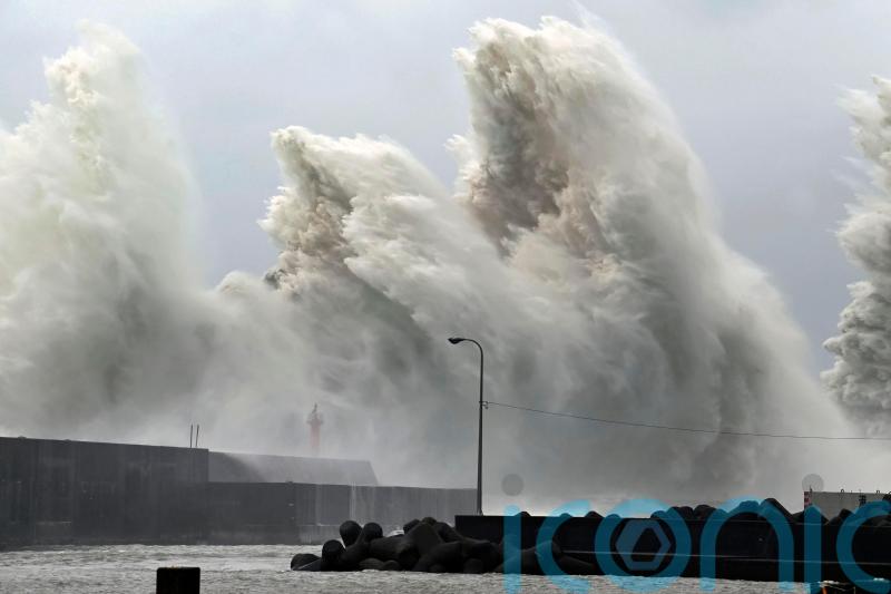 Two dead and thousands left without power after tropical storm lashes Japan