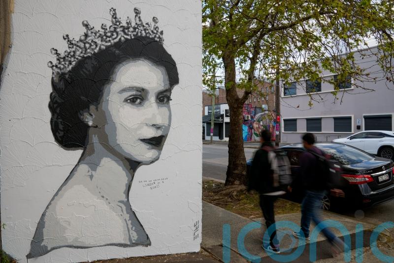 Union flag set on fire while Australia marks national day of mourning for Queen