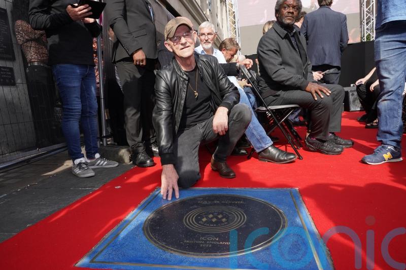 David Bowie’s drummer reflects on singer’s legacy as Walk of Fame stone unveiled