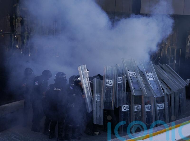 Mexican police injured in blast during protest over students’ disappearance