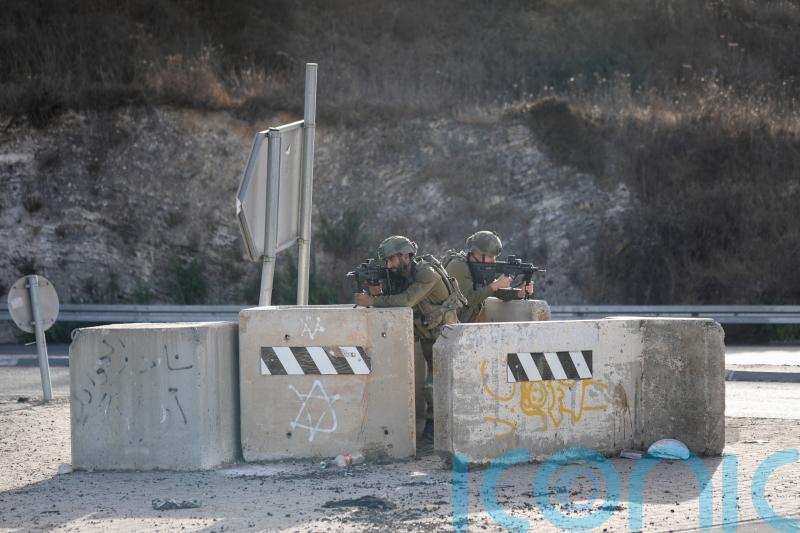 Israeli soldiers shoot Palestinian motorist in alleged ramming attack