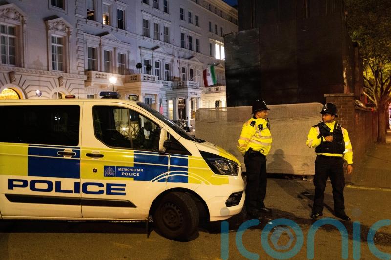 Protesters clash with police outside Iranian embassy in London