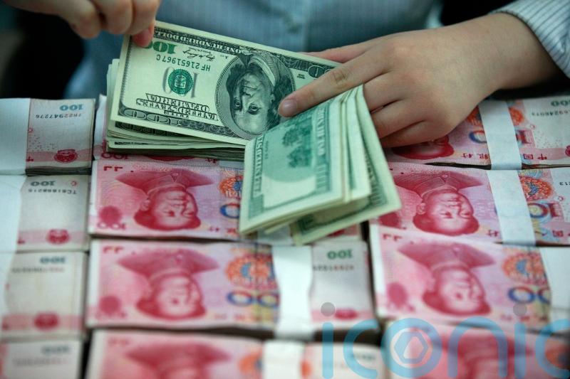 China’s yuan slides to 14-year low against dollar after US rate hikes