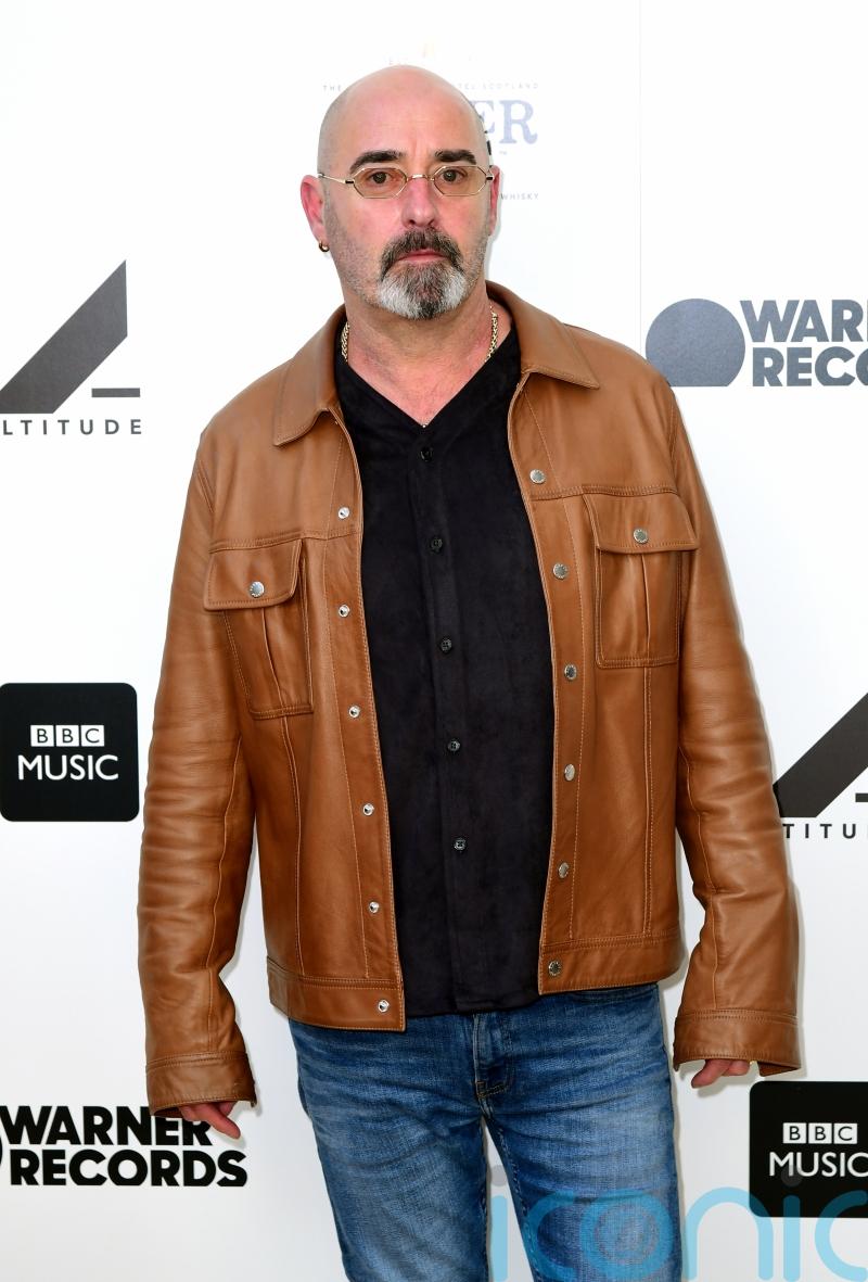 Former Oasis guitarist Bonehead says his tonsil cancer has ‘gone’