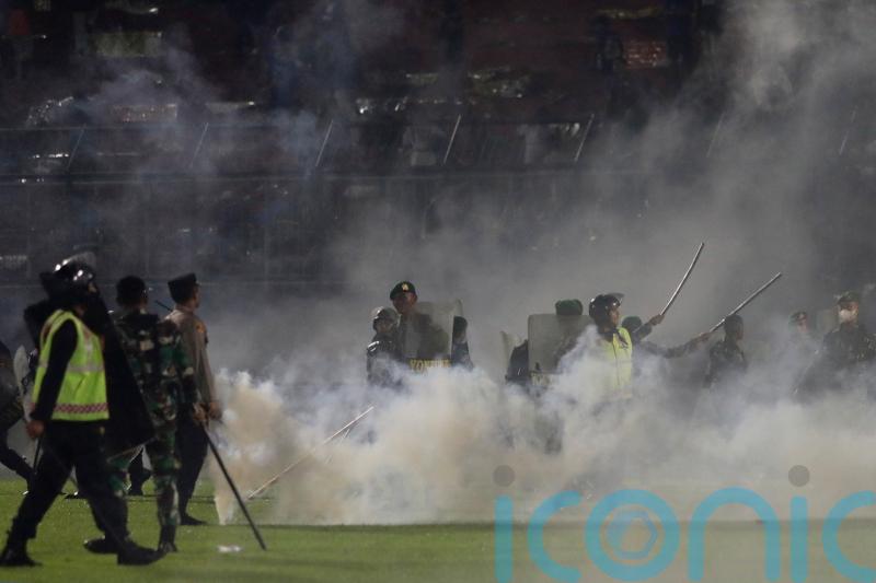More than 100 football fans and two police officers killed in Indonesia stampede