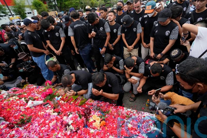 Police probe tear gas use at Indonesian football match after 125 die in crush