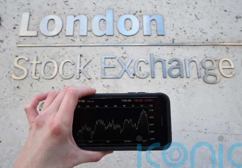Sterling falls against a stronger dollar as FTSE 100 slips into the red