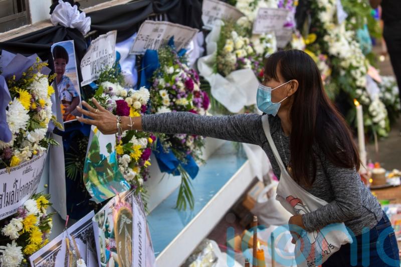 Families hold Buddhist ceremony for children killed in Thailand attack