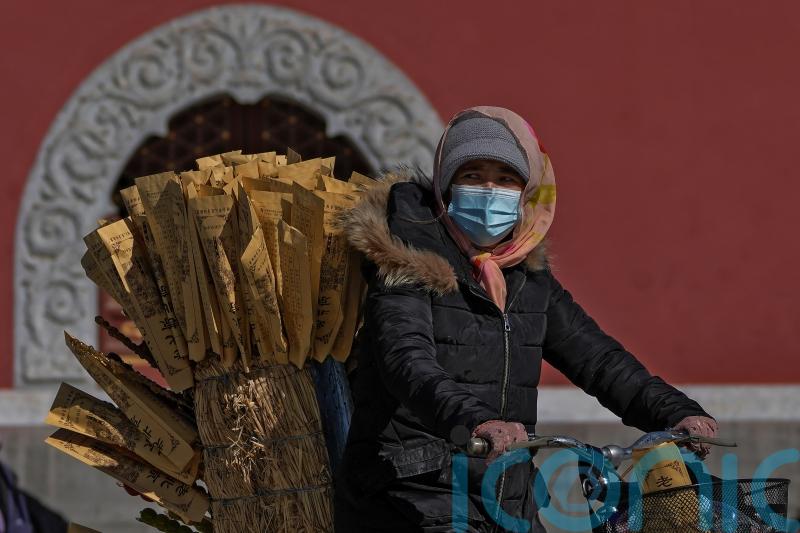 China imposes lockdowns as Covid-19 surges after holiday