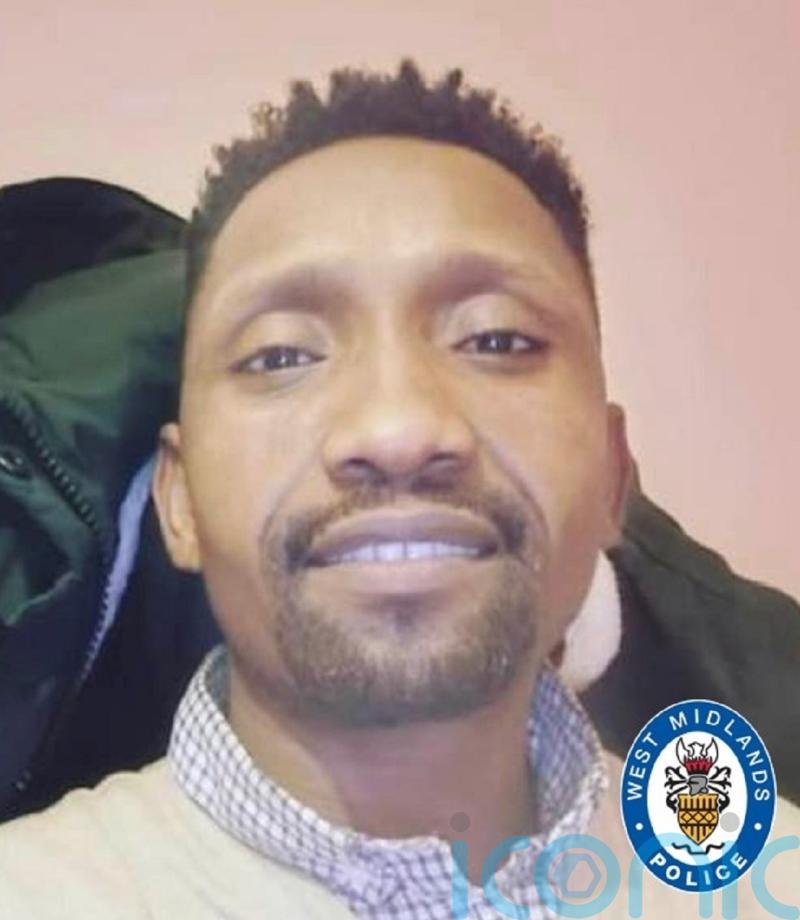 Three arrested in murder inquiry after father found dead in block of flats