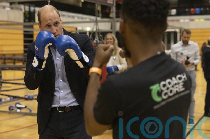 William praises power of sport while demonstrating boxing prowess
