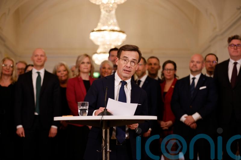 New Swedish PM presents three-party centre-right government