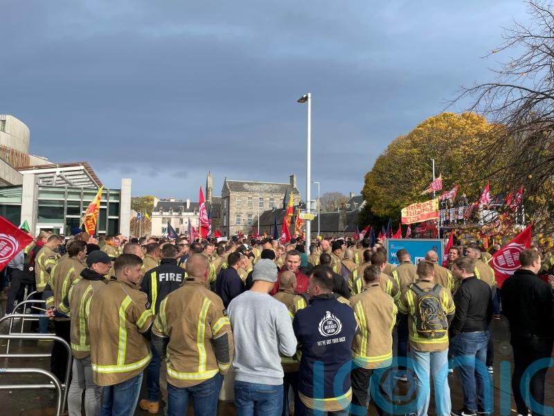 Firefighters demonstrate outside Scottish Parliament over pay and cuts
