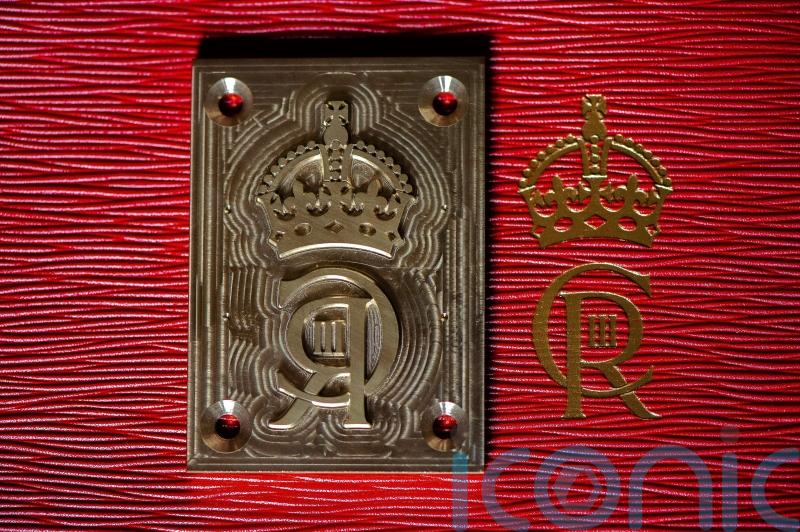 Brass die will emboss King’s cypher on to famous red boxes