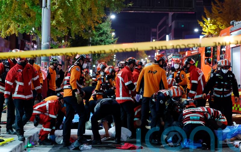 At least nine dead and 100 injured after Halloween crowd surge in Seoul