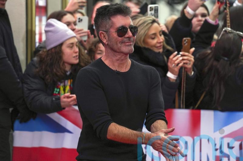 Simon Cowell says he was ‘really unhappy’ and a workaholic before becoming a dad
