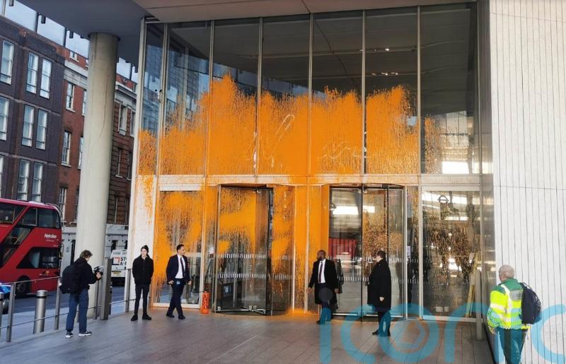 Arrests made after Just Stop Oil activists spray orange paint on buildings