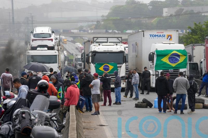 Lorry drivers backing Bolsonaro block hundreds of roads in election protest