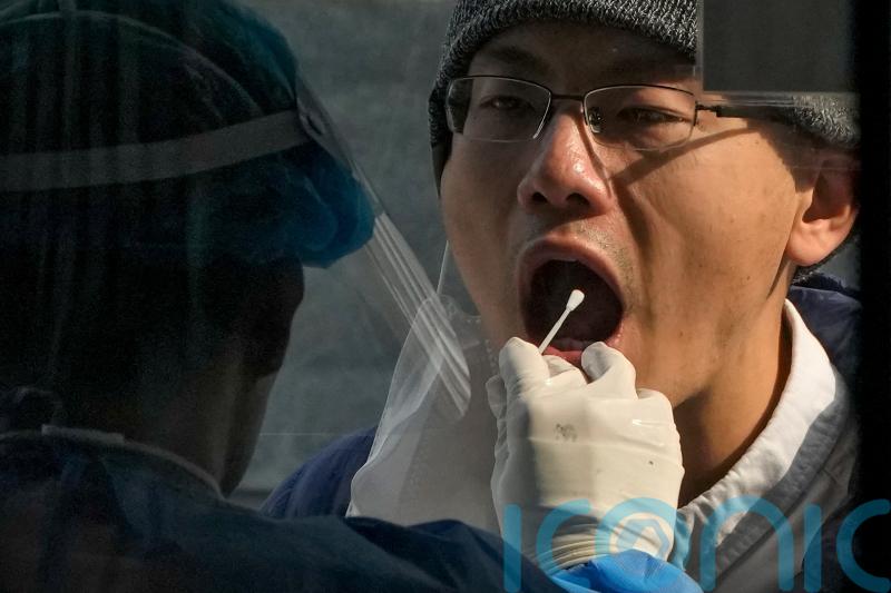 China closes zone around iPhone factory after virus cases