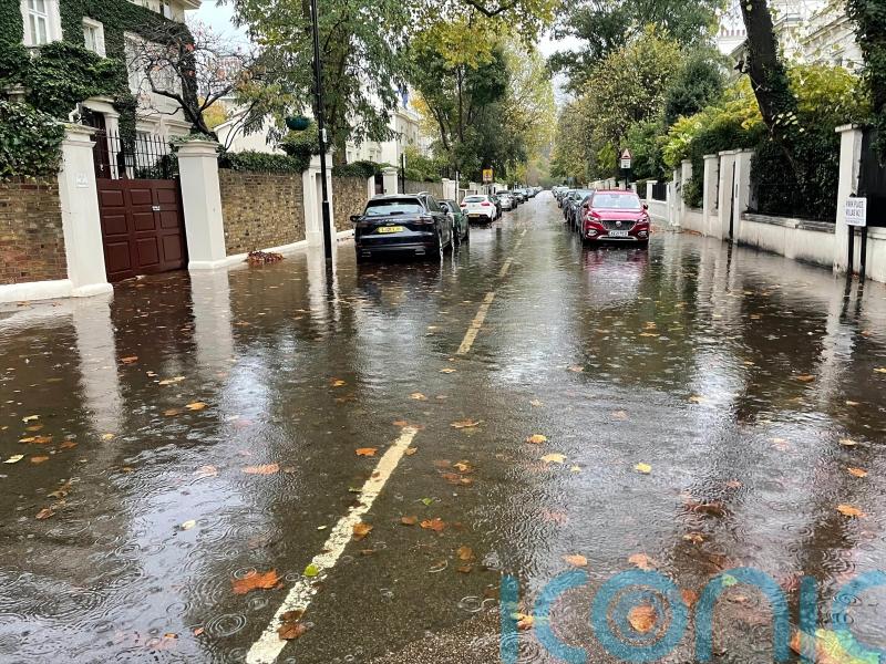 Heavy downpours lead to flooding and transport disruption