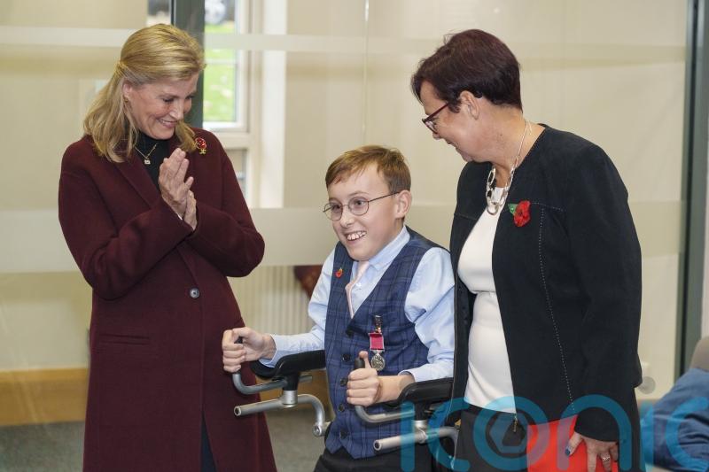 Youngest honours recipient Captain Tobias gets his BEM from royal visitor