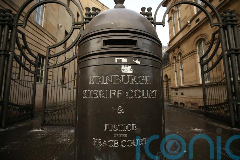 Second person charged after two men found dead in Edinburgh flat