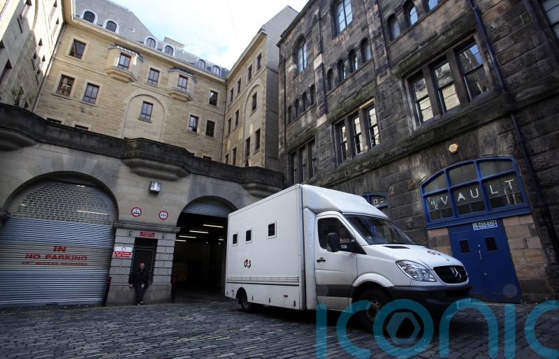 Second man in court charged with murder over deaths of men in flat