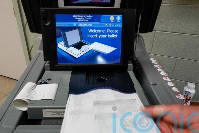 Election scrutiny high but no big hitches reported amid voting in US midterms