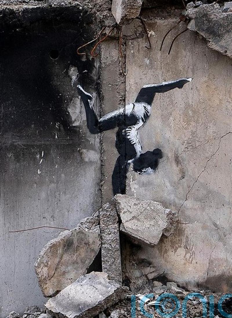 Banksy reveals artwork on side of damaged building in Ukraine