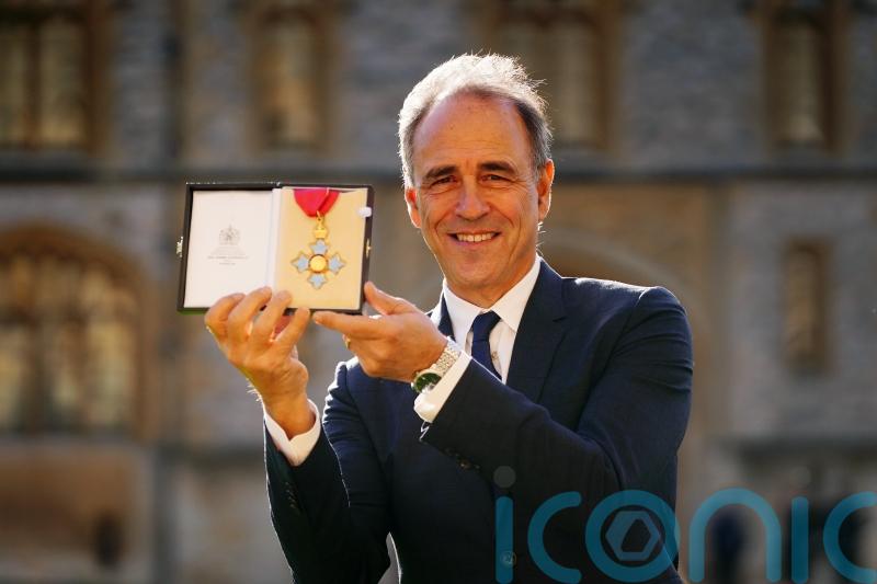 Anthony Horowitz calls for investment in school libraries as he receives CBE