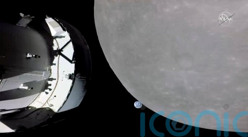 Nasa capsule in slingshot move around moon in last big step before lunar orbit