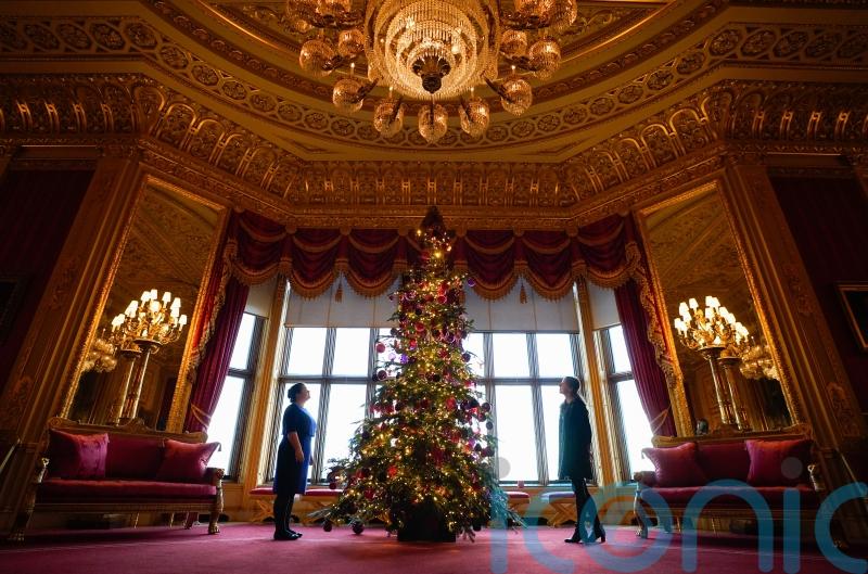 In Pictures: Royal staff deck Windsor Castle hall with 20ft Christmas tree