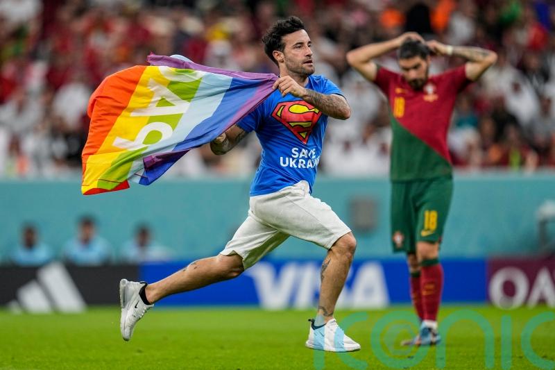 Man who invaded pitch with rainbow flag banned from World Cup matches