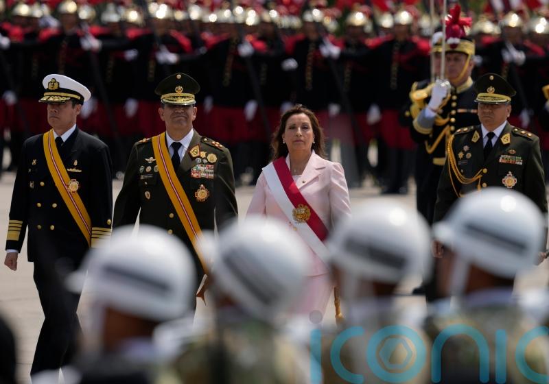 New Peru president appears with military to cement power