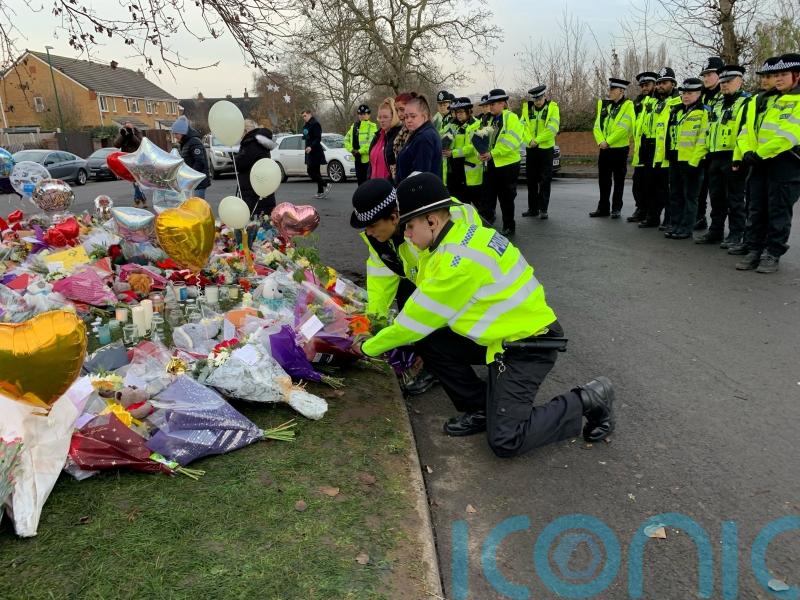 Tearful police pay silent tribute to boys who died in ice-covered lake tragedy