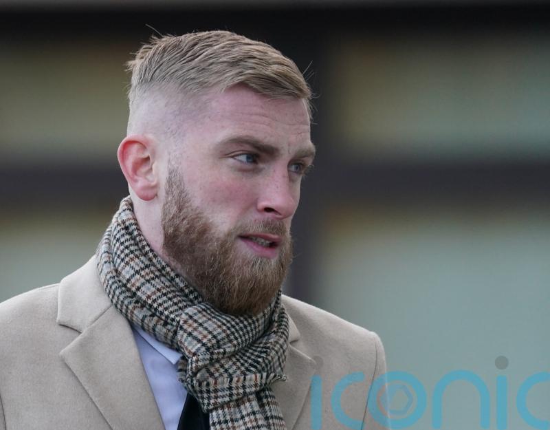 Assault charge footballer tells court he hopped over fan to protect injured foot