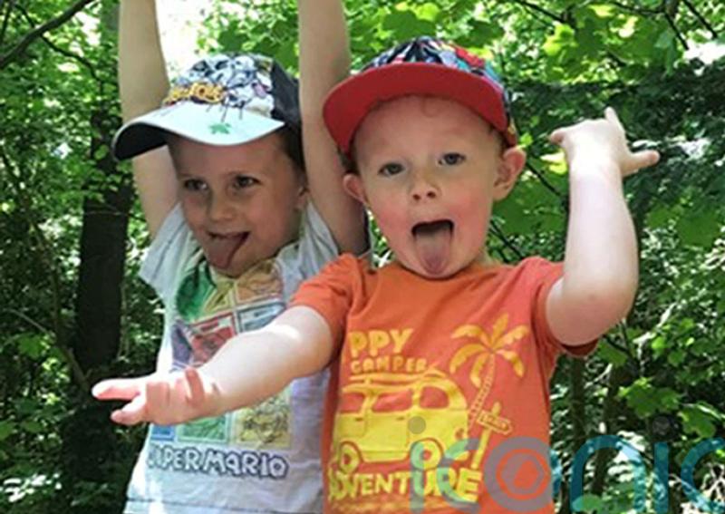 Two brothers among four boys who died after being pulled from icy lake