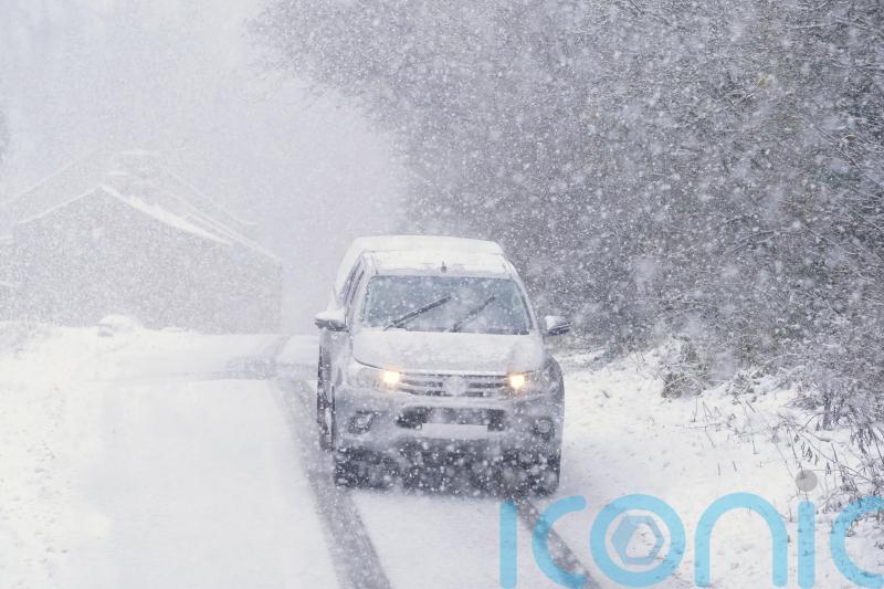 Amber weather warning in force as snow brings travel disruption