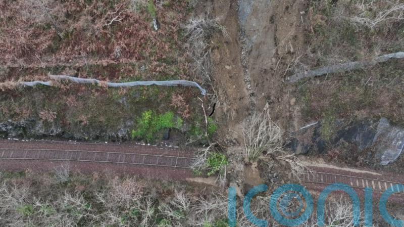 Engineers assessing damage caused by landslide near Falls of Cruachan